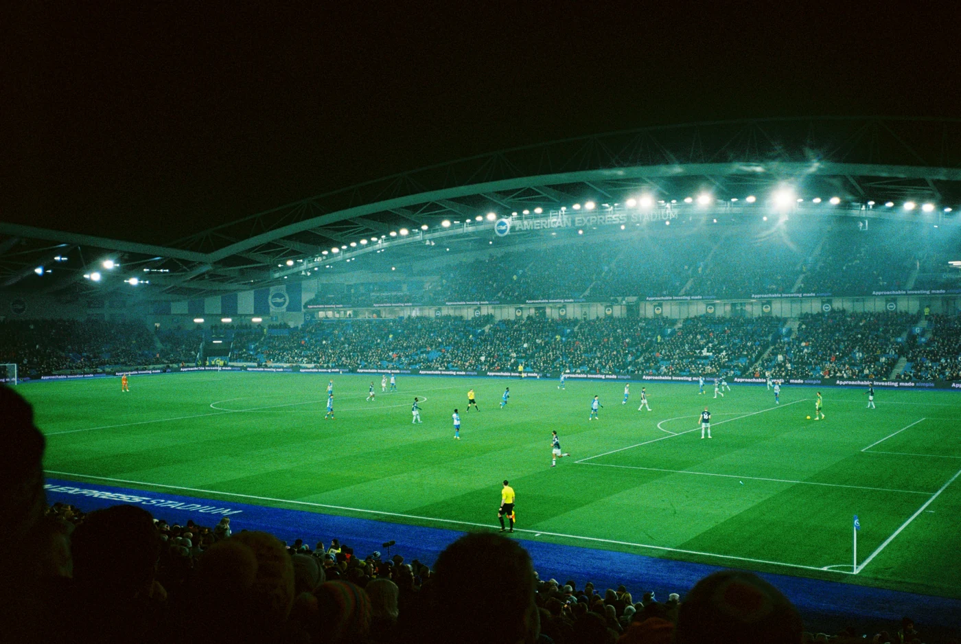 A floodlit football stadium on match night
